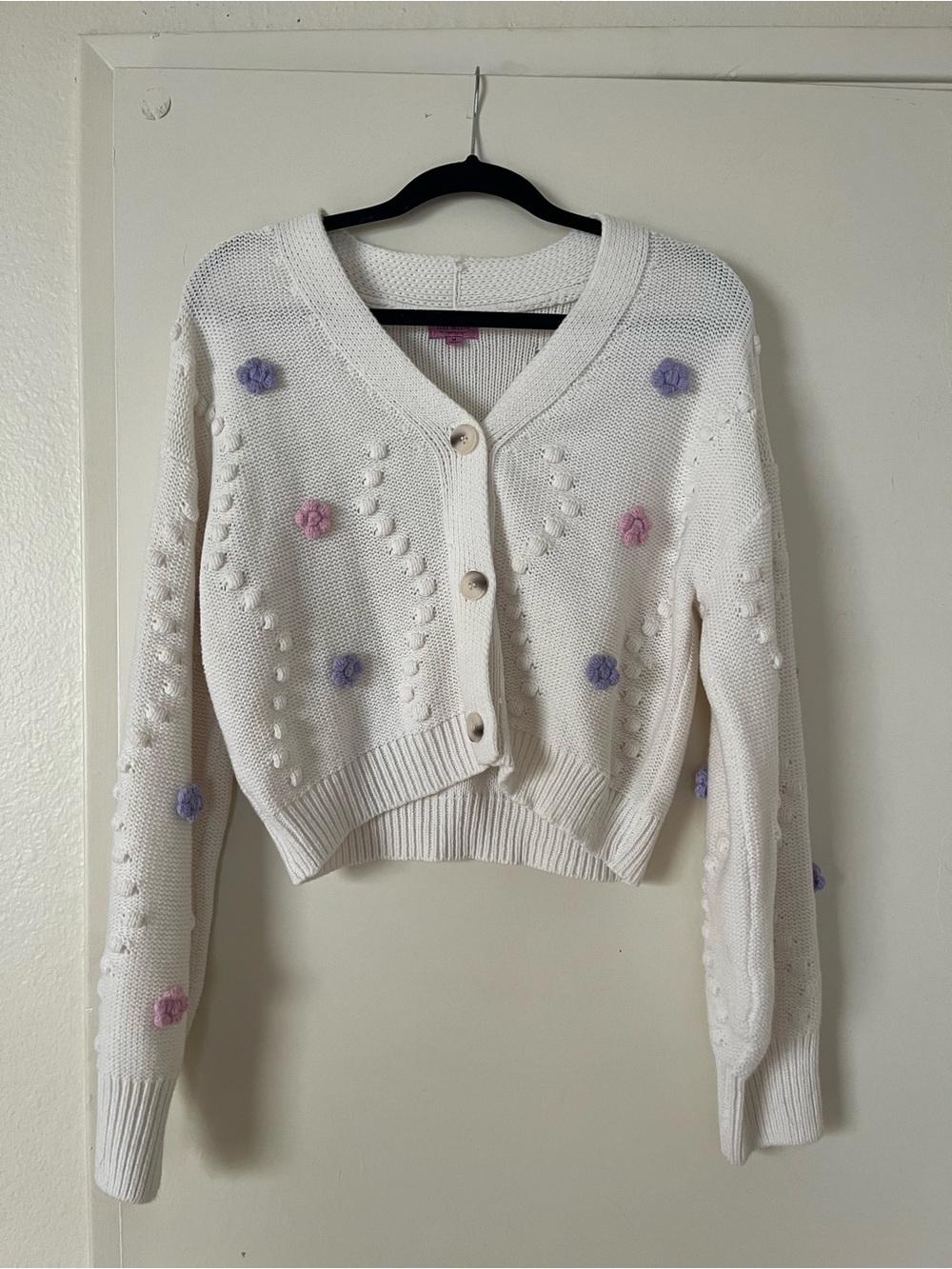 Francesca's Collections Cream Cropped Cardigan with Pink & Lavender Poms